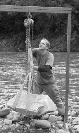 Retrieving a natural boulder from the river