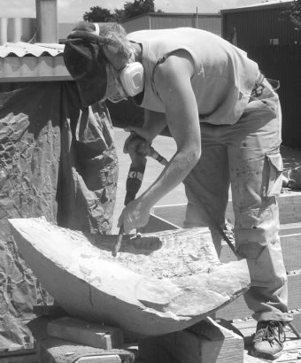 Chisseling a headstone